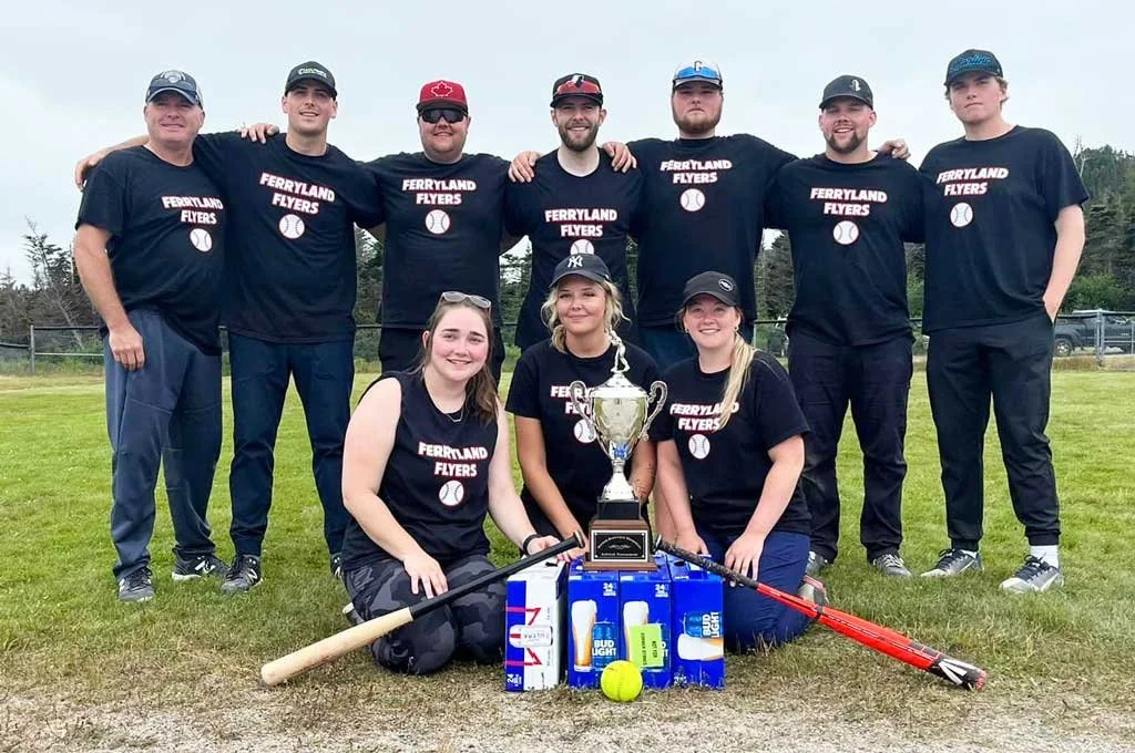  The Ferryland Flyers were named inaugural Dicker Barnable Memorial Softball Tournament champions. In the back row, from left to right, are Colin Swain, Andrew Kelly, Daniel Byrne, Patty O’Leary, Kaleb Swain, Shayne Kavanagh, and Connor Swain. In the front, from left to right, are Emily Kavanagh, Jenna Freeman, and Abby Boland. Submitted photo 