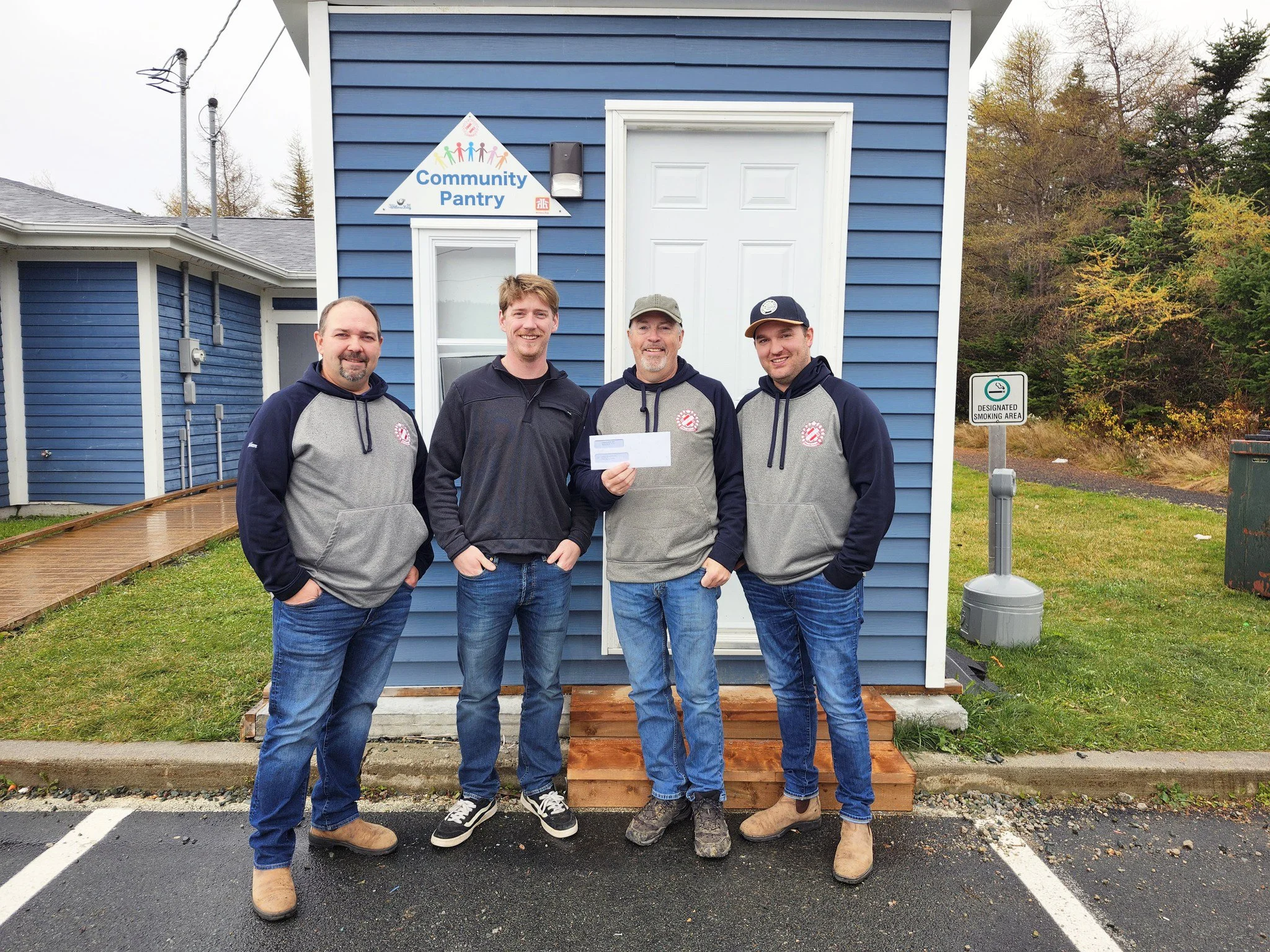  Members of the Kinsmen Club of Witless Bay and Area this October opened a new, walk-in pantry at the Puffin Centre. The Town of Witless Bay recently donated registration fees from a recent flea market and upcoming craft fair, some $260 all told, to the club to help stock the community pantry. From left are Kinsman Adam Carey, Deputy Mayor Jacob Hayden, Kinsman Brian Harte and Kinsman Mark Tobin. Town of Witless Bay photo  