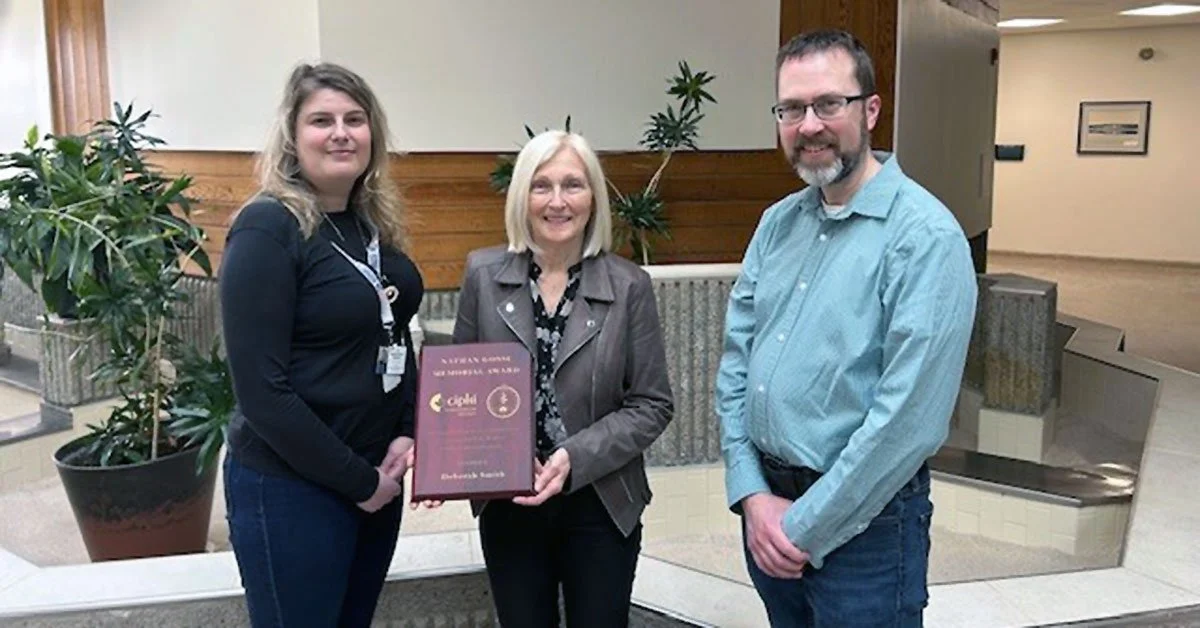  A Goulds resident is this year’s recipient of the Nathan Gosse Memorial Award for significant contributions to the field of environmental health. Deborah Smith was presented with the award at a meeting of the Newfoundland and Labrador Branch of the Canadian Institute of Public Health Inspectors (CIPH). Smith is Manager of Laboratory Services at the City of St. John’s Regional Water Supply. She started her career in the mid 1970s as a Medical Laboratory Technologist at Western Memorial Regional Hospital in Corner Brook. Since 1982, the Witless Bay native has been employed with the City of St. John’s Regional Water System where she was the lone technologist for over 20 years. Smith’s duties include managing the laboratories at the Bay Bulls Big Pond Water Treatment Plant, Windsor Lake Water Treatment Plant, Petty Harbour Lond Pond Water Treatment Plant and the Riverhead Wastewater Treatment Facility. Smith and her staff also look after 70 water sampling stations throughout the regional water supply system, analyzing water and wastewater samples from source to tap to harbour. The award is named for the late Director of Environmental Health for the Province of Newfoundland and Labrador, who hailed from Harbour Grace. Presenting her with the award were CIPH past president Tammy McDonald, left, and fellow institute member Douglas Howse. 