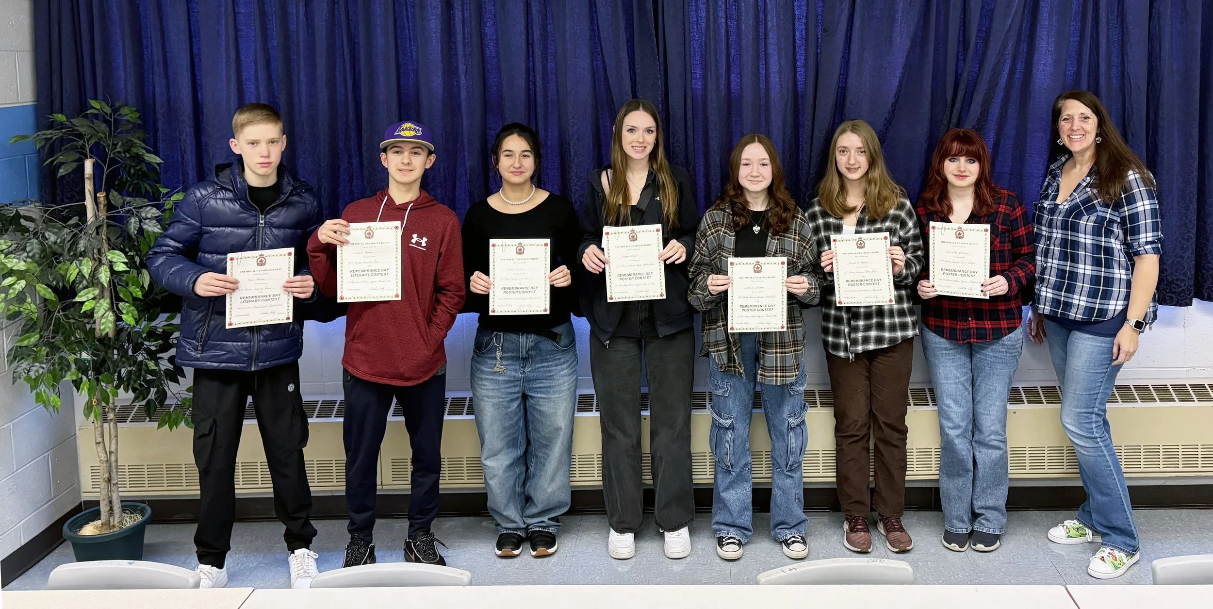  St. Kevin's High School in the Goulds is congratulating all the students who participated in this past fall’s Remembrance Week Poster and Literary Contest, which was hosted by Branch 34 of the Royal Canadian Legion in Ferryland, which serves the whole of the Southern Shore, Goulds and Petty Harbour, as well as by the Provincial Command as the contest was province wide. Teachers Tracy Nixon and Greg White were also thanked for encouraging the students to submit their art designs and literary works. Initial judging was done by volunteers at local Legion branches. The winning entries were then judged at the provincial level. Among the St. Kevin’s students who participated were, from left: Noah Peters (3rd place in Poetry), Lucas Mercer (2nd place in Poetry), Lara Geves (1st place Colour Poster), Alyssa Byrne (1st place black and white Poster), Isabelle Chaignon (3rd place black and white Poster), Meredith Parsons (3rd place colour Poster), Charlotte Philpott (2nd place colour Poster), and Nixon. Missing from the photo is Cara Kelly (2nd place black and white Poster).  