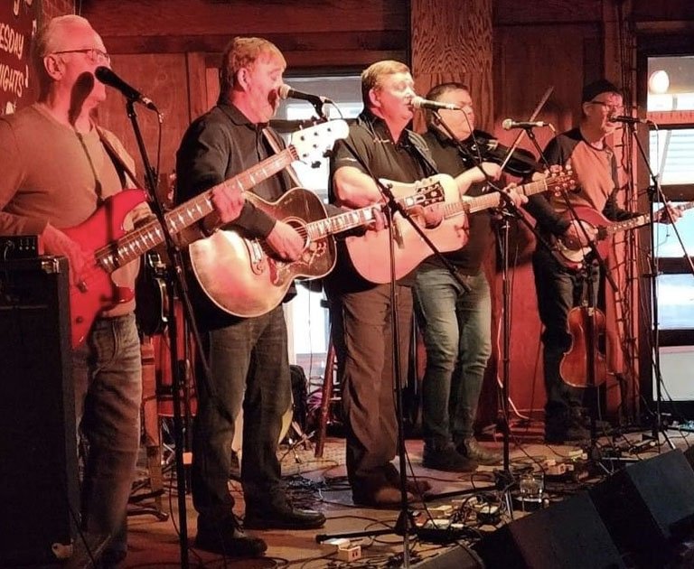  The Masterless Men bandmembers include, starting from left: Mock Greene on bass, Wilf Curran on guitar and lead vocals, John Curran on guitar and lead vocals, Greg Walsh on fiddle, and Dave Lush on banjo. Greg and Dave also sing backup and harmony vocals. Masterless Men photo. 