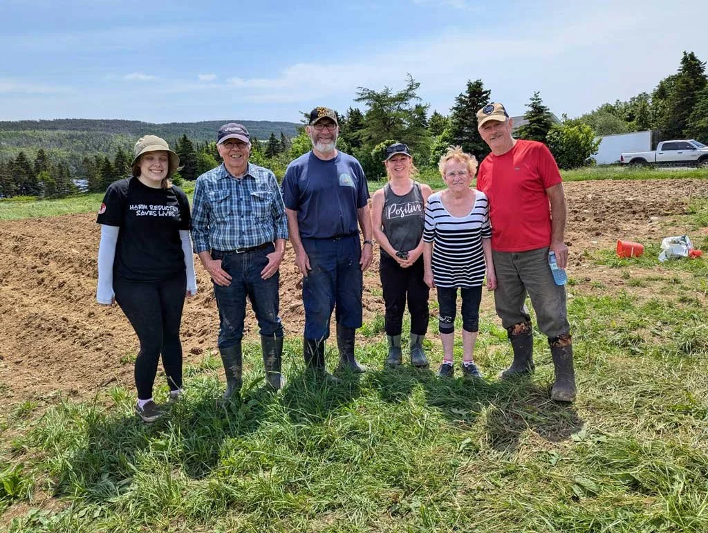  A number of community volunteers have banded together to grow produce for local food banks. From left to right are Amy Williams, Rev. Fred Marshall, Alan Goodridge, Heather Melindy, Lena Ruby, and Dave Ryan. 