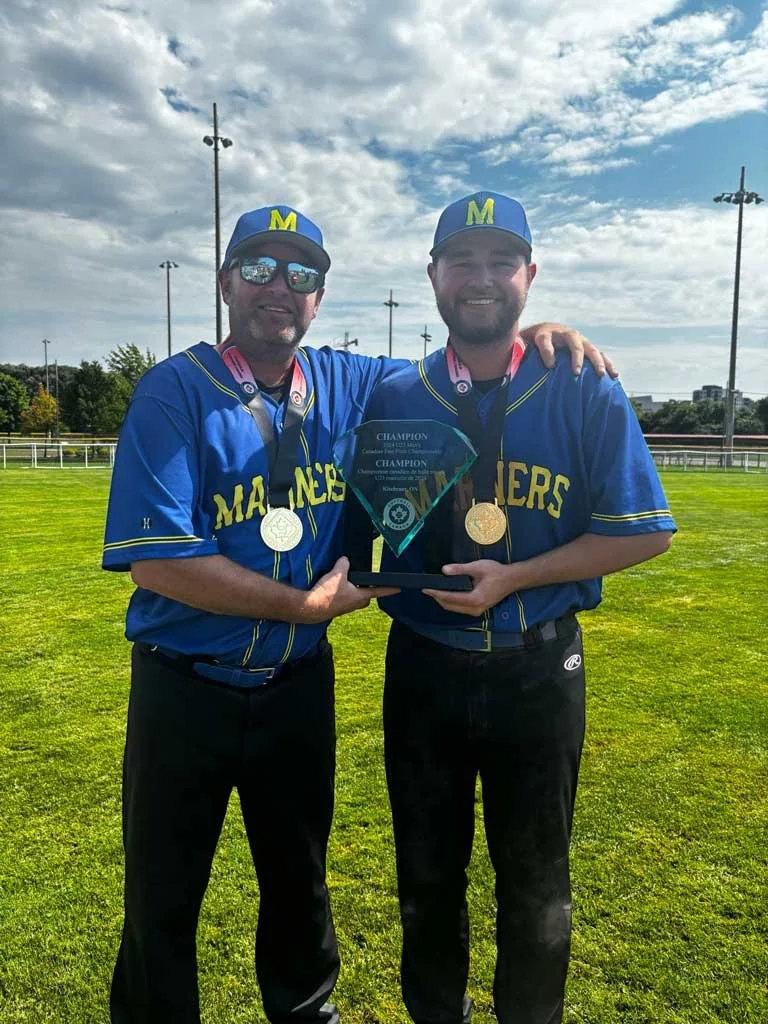  Father-son duo Chris and Ryan Maher of Petty Harbour-Maddox Cove celebrate a national fastpitch win in Kitchener, Ontario, this past week. Submitted photo 