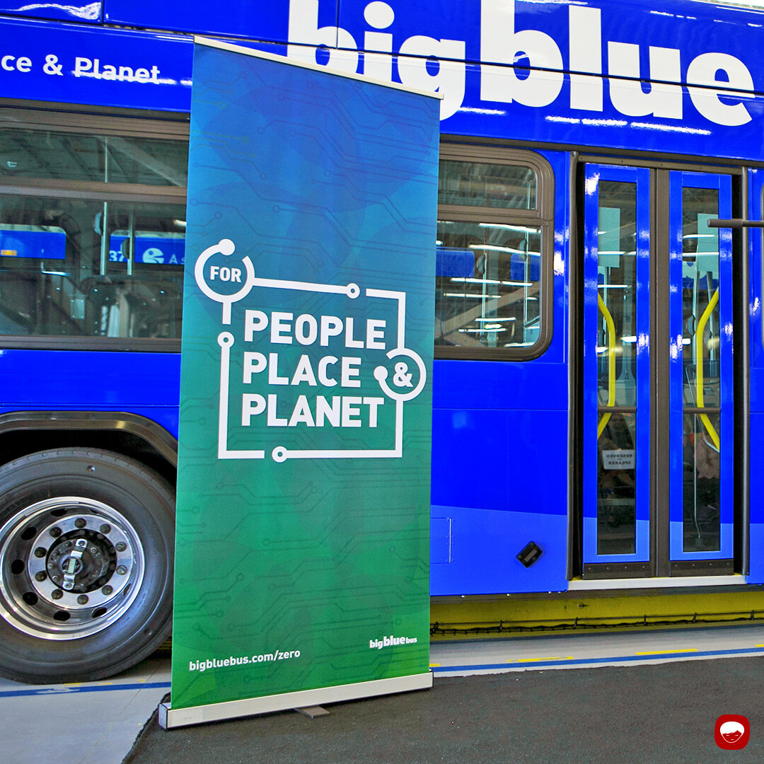 campaign - big blue bus - battery electric bus - roll-up vertical banner
