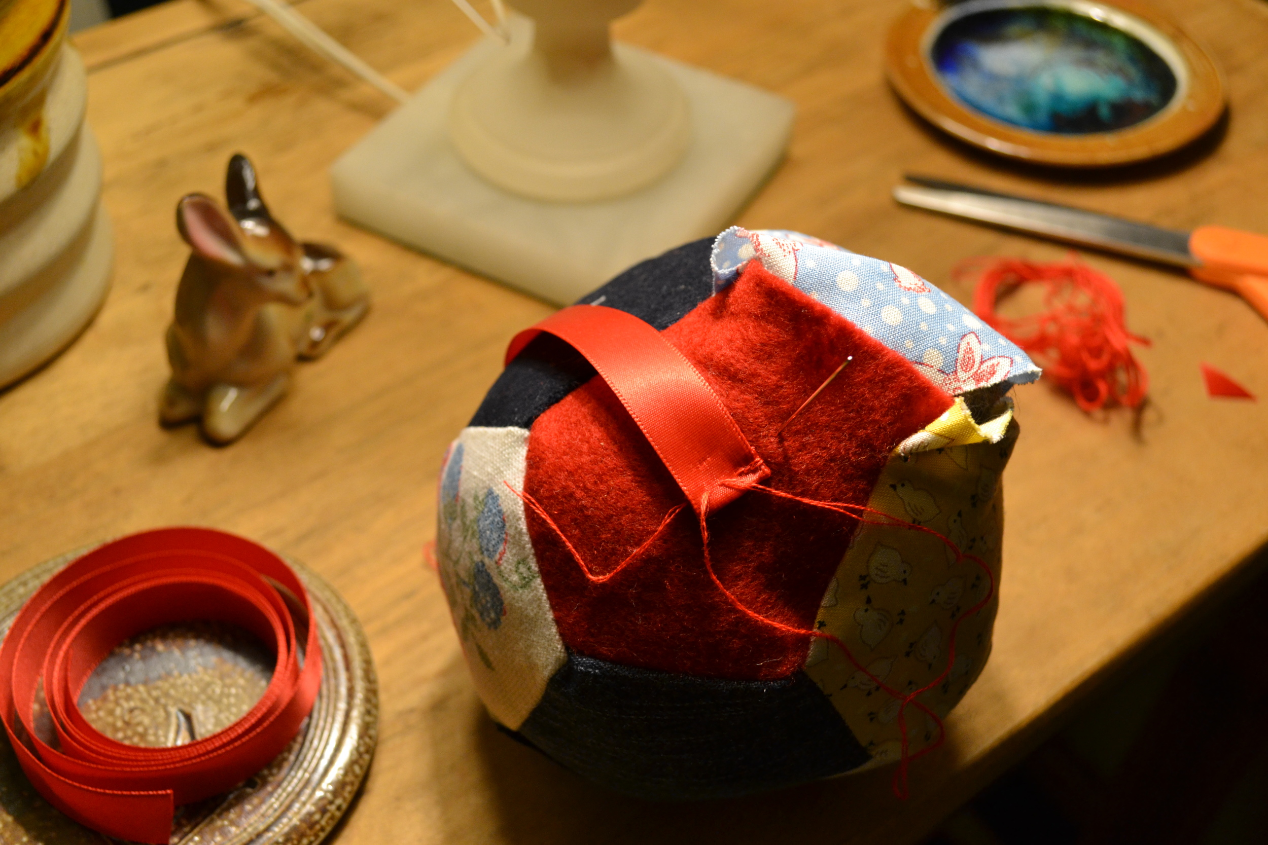 sewing on a handle and sewing the opening shut
