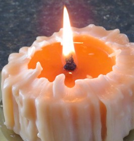 When the wax pool nears the edges and the wax near the candle wall is softened, carefully push the wax toward the wick, thus raising the wax pool. You can burn the whole candle & not be left with a large chunk of wax!!