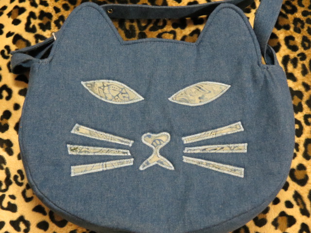 Locally-crafted purses, wallets, bags