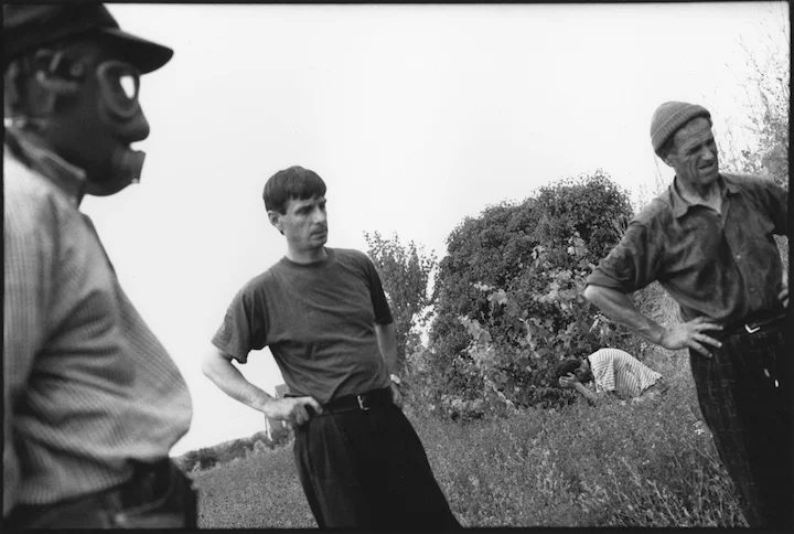 When NATO's bombing campaign started and the Serb military intensified it's operations knowing that their reign was about to end many Kosovar families were separated in the chaos that ensued. Only when the conflict ended and families returned home from neighboring countries could they determine who had survived. The Kbasci family could not account for four of their number: Shaip (66), his wife Sanije (62), their son Ramadan (41) and grandson Floren (6 months). Shortly after making it home they heard from neighbours that their kin had been executed and buried in a field on their farm. These photographs show the men of the family exhuming the bodies and taking them to the women for reburial. 
