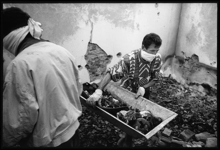 In the village of Cara Luka the uncle of 13 boys and 9 girls from the Krasniqi family shot and burned in their home by Serb military forces collects their remains in a wheel barrow for reburial. The oldest child was 19 years old. 
