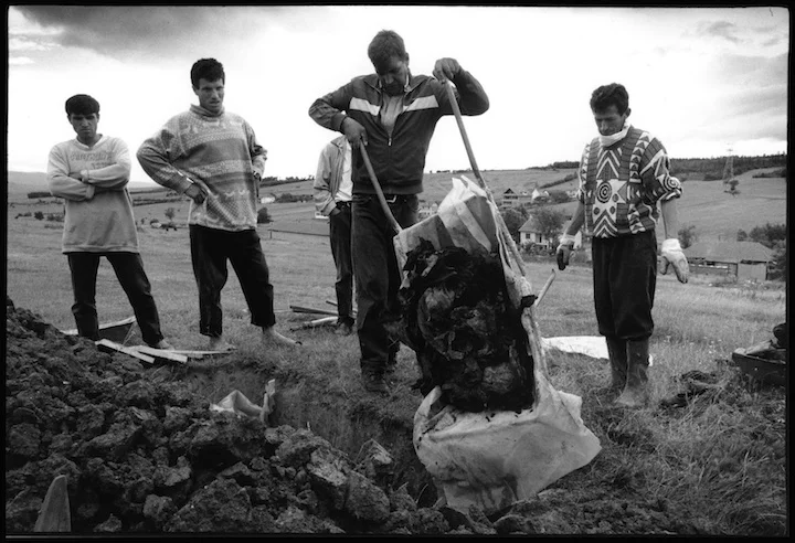 In the village of Cara Luka the uncle of 13 boys and 9 girls from the Krasniqi family shot and burned in their home by Serb military forces collects their remains in a wheel barrow for reburial. The oldest child was 19 years old. 