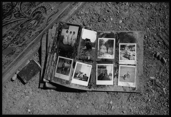 A family photo album found outside a home in thee village of Velika Krusha, Kosovo. Serb forces routinely destroyed family mementos and other indicators of identity and belonging. 