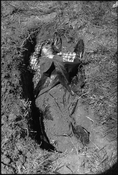 When NATO's bombing campaign started and the Serb military intensified it's operations knowing that their reign was about to end many Kosovar families were separated in the chaos that ensued. Only when the conflict ended and families returned home from neighboring countries could they determine who had survived. The Kbasci family could not account for four of their number: Shaip (66), his wife Sanije (62), their son Ramadan (41) and grandson Floren (6 months). Shortly after making it home they heard from neighbours that their kin had been executed and buried in a field on their farm. These photographs show the men of the family exhuming the bodies and taking them to the women for reburial. 