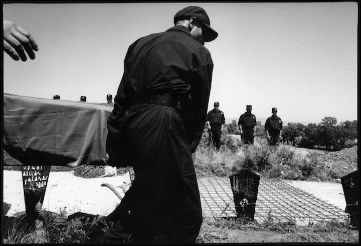 KLA soldiers bury their dead under reinforced concrete because Serb military had recently exhumed bodies of their colleagues.