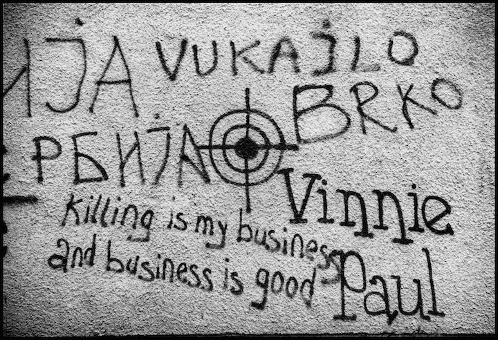 Graffiti on a roadside wall between Prizren and Pristina.