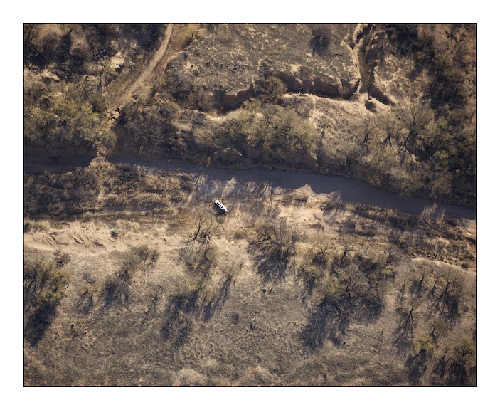  An overturned migrant vehicle in a dried river bed in the Altar Valley near Sasabe in Southern Arizona. Coyotes - the name given to human and drug traffickers - pick migrants up in pre-arranged locations in the desert and then drive them further int
