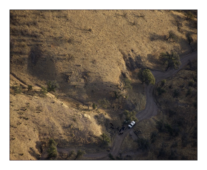  Two United States Border Patrol vehicles parked next to their horses on a trail in Baboquivari Mountains in the Sonoran desert. The Border patrol use horses to patrol remote areas where their vehicles cannot pass.&nbsp; 