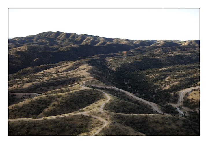  The border fence between Mexico (above) and the United States (below) snakes it’s way through the desert scrub east of Nogales in the Pajarita Mountains in Southern Arizona. 