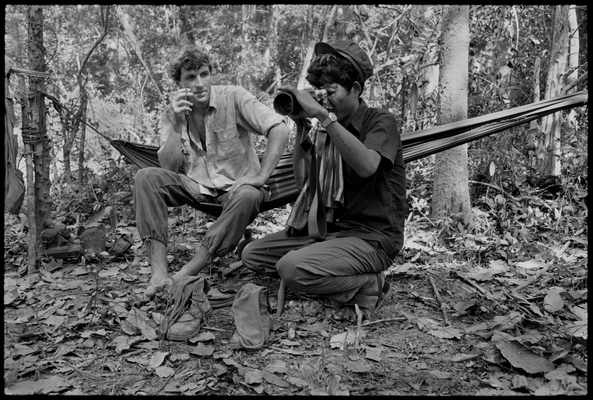  Thierry shows the Khmer Rouge how to use his Nikon. Cambodia. 1991 