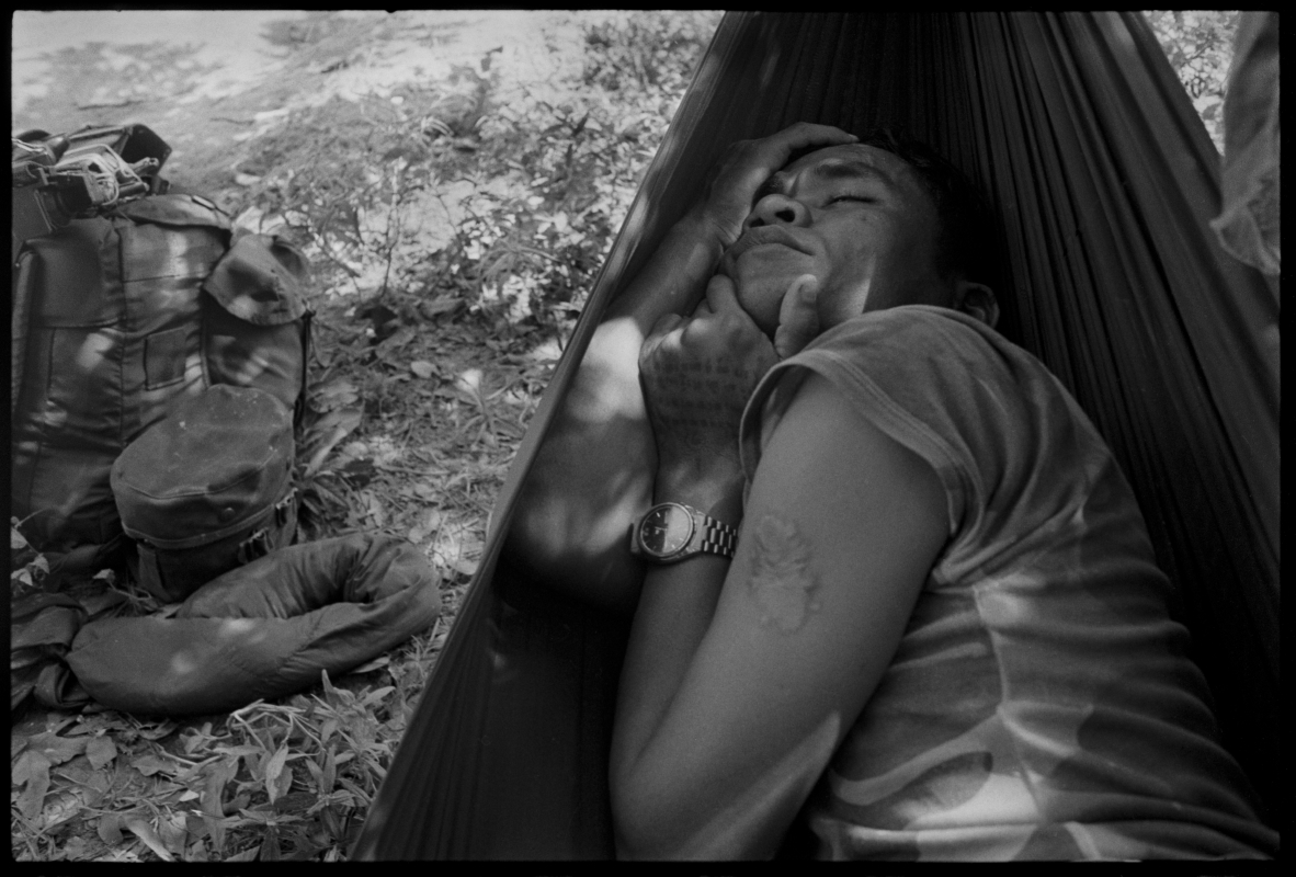  KPNLF soldier sleeps after a 40 km march during a long range 6 week mission, Cambodia,&nbsp;1991 