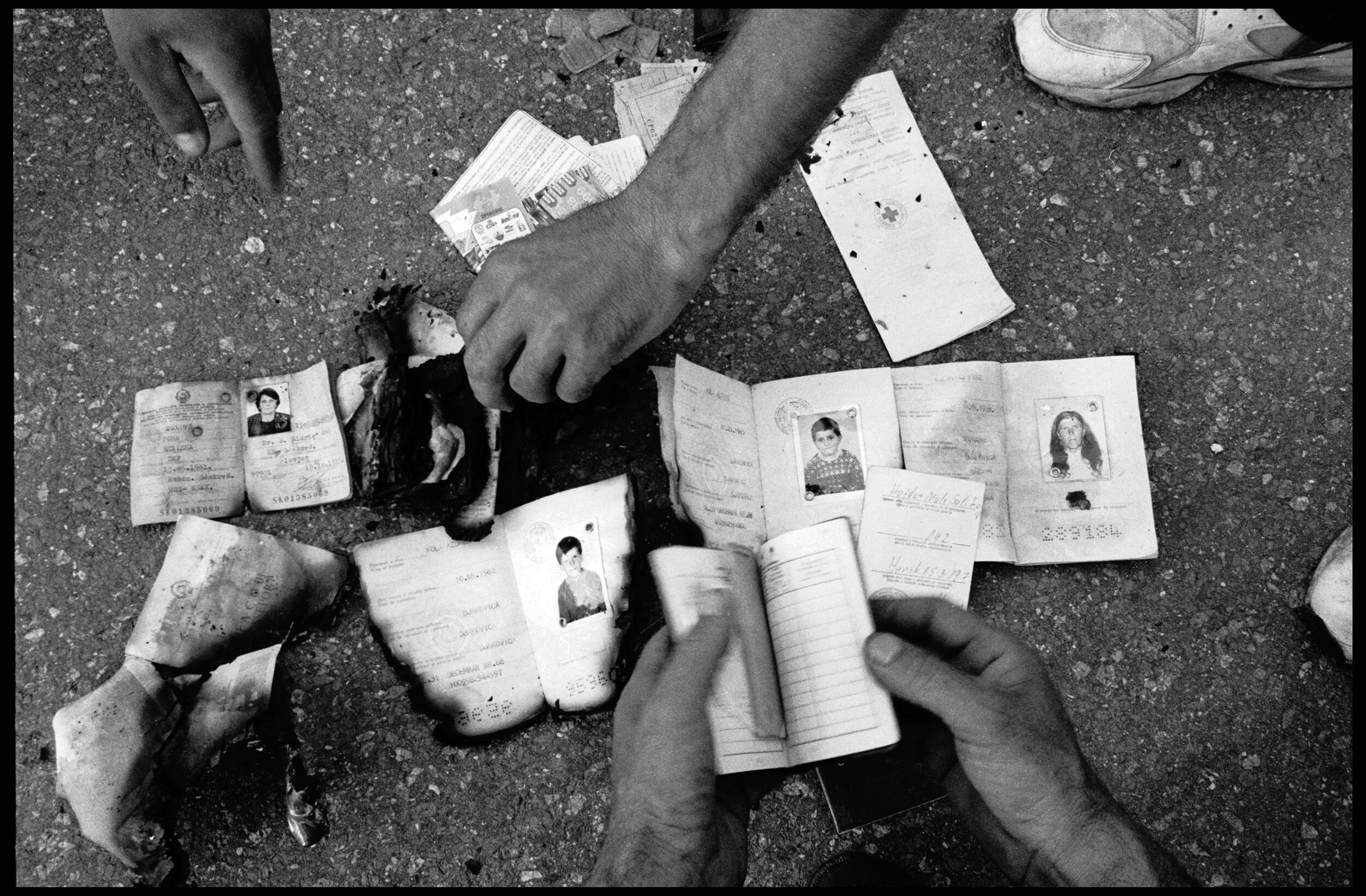  Identity documents of people presumed murdered next to a mass grave near Meja, Kosovo. 