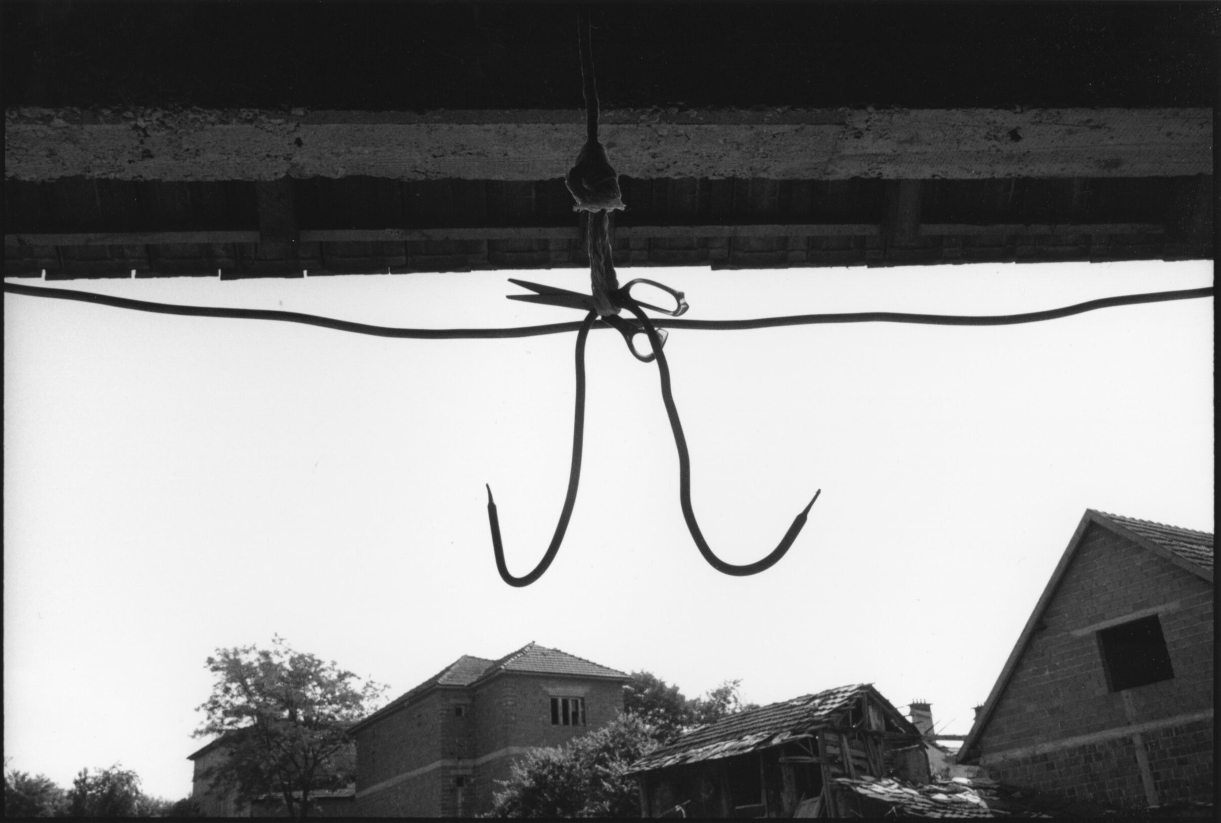  Meat hook hanging from a farm in Velika Krusha where many civilians were executed. Under the hook I found a lot of pornographic magazines. 