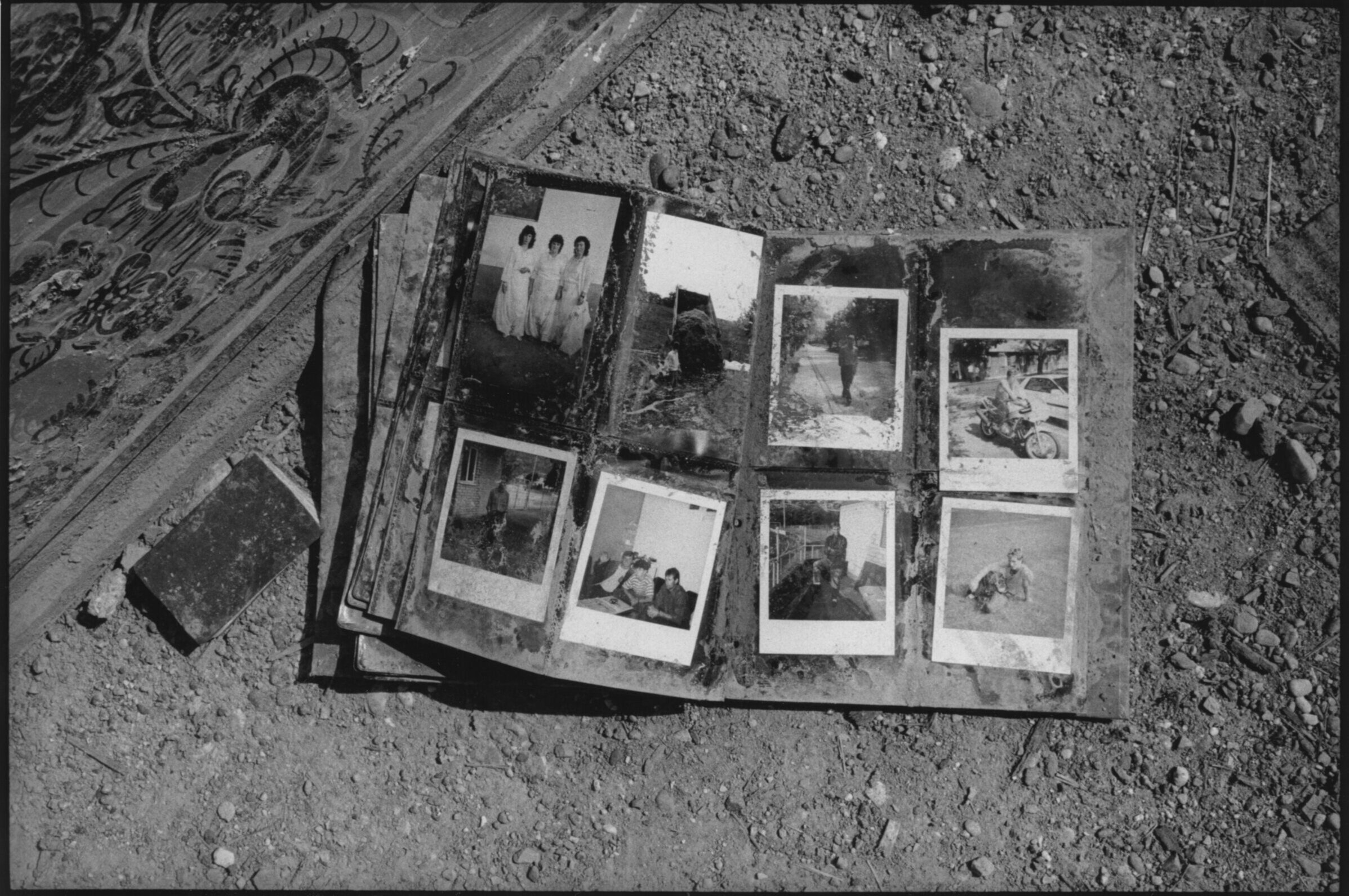  A family photo album found outside a home in thee village of Velika Krusha, Kosovo. Serb forces routinely destroyed family mementos and other indicators of identity and belonging. 