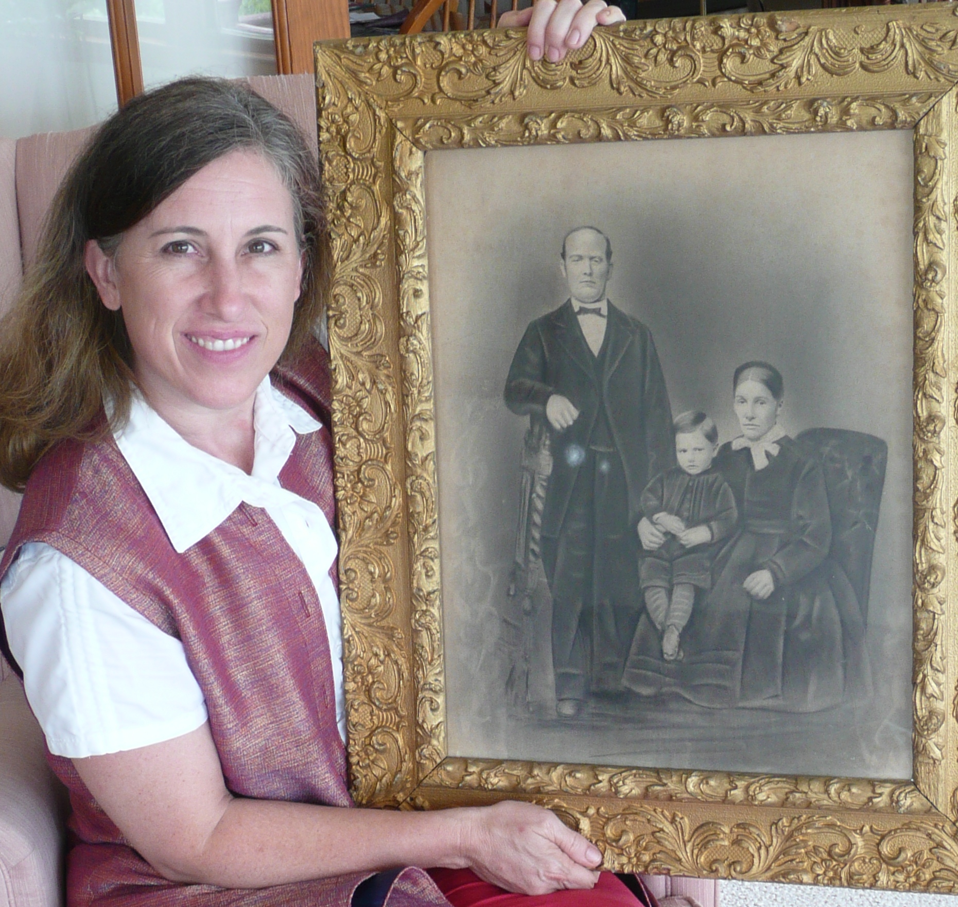 Above: Lisa holds up an image of her great, great grandfather, Pierre Schirch, and his family. Below: Lisa (left) walks w/ Colonel John Agoglia and NGO leaders from Afghanistan and Pakistan while discussing the relevance of humanitarian principles.