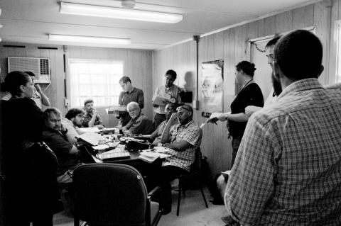 A visiting team discusses a day's work at our Guantanamo office.
