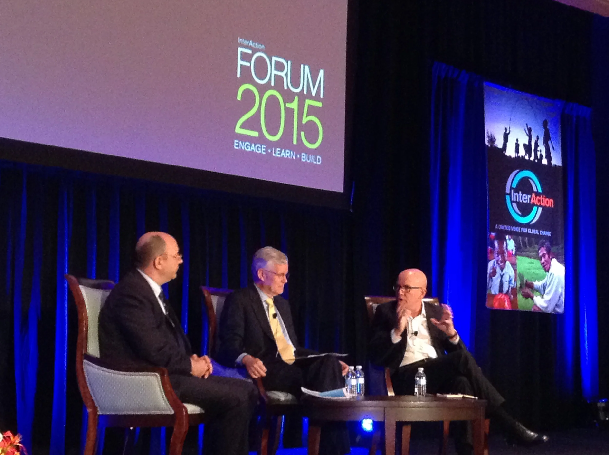 The icrc's yves daccord (right) talks to the panel's moderator, sam worthington (center) and fellow panelist, thomas gass (left), about today's most pressing humanitarian needs.