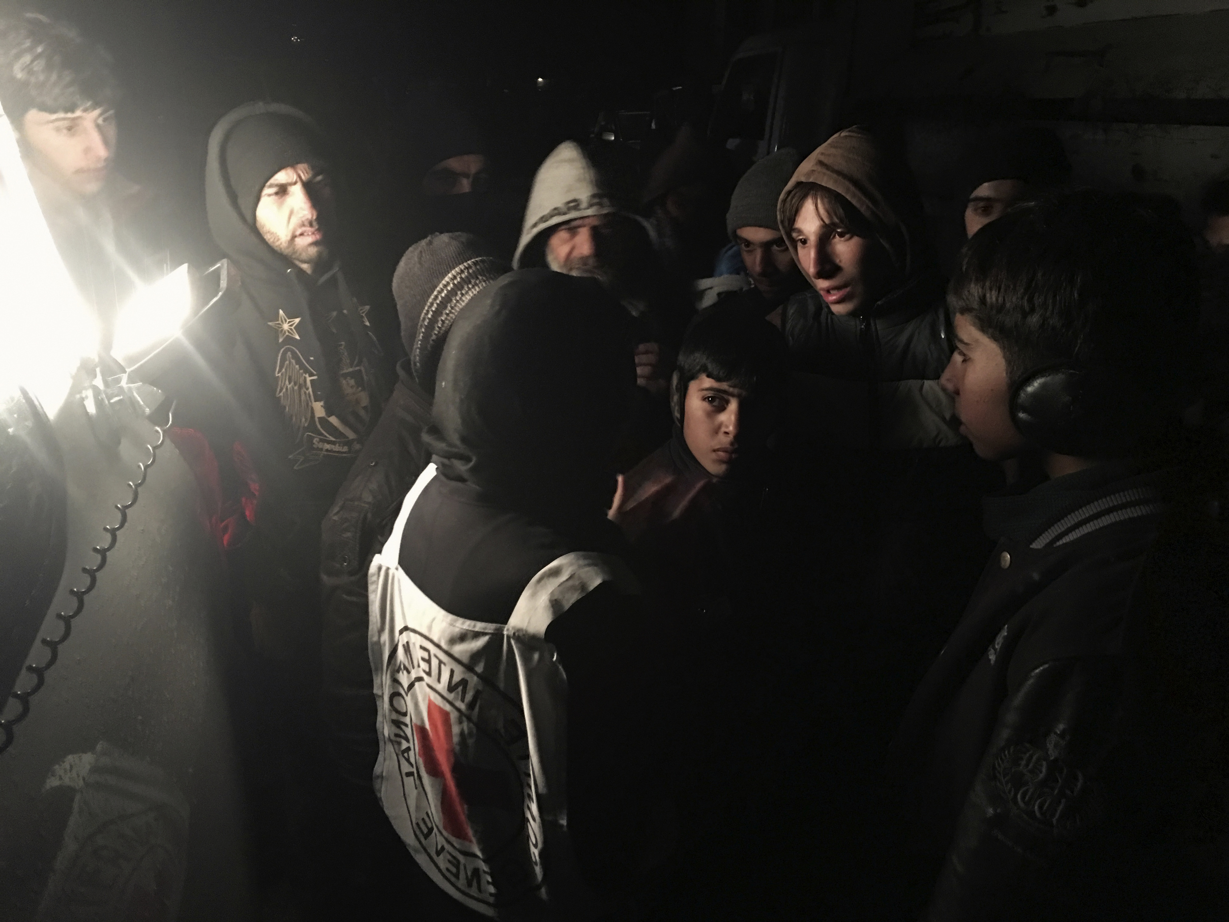 JANUARY, 2016, MADAYA. ICRC's HEAD OF DELEGATION IN SYRIA, MARIANNE GASSER, SPEAKS TO RESIDENTS AS THEY GATHEREr AROUND AN AID CONVOY. © ICRC/ pawel KRZYSIEK.
