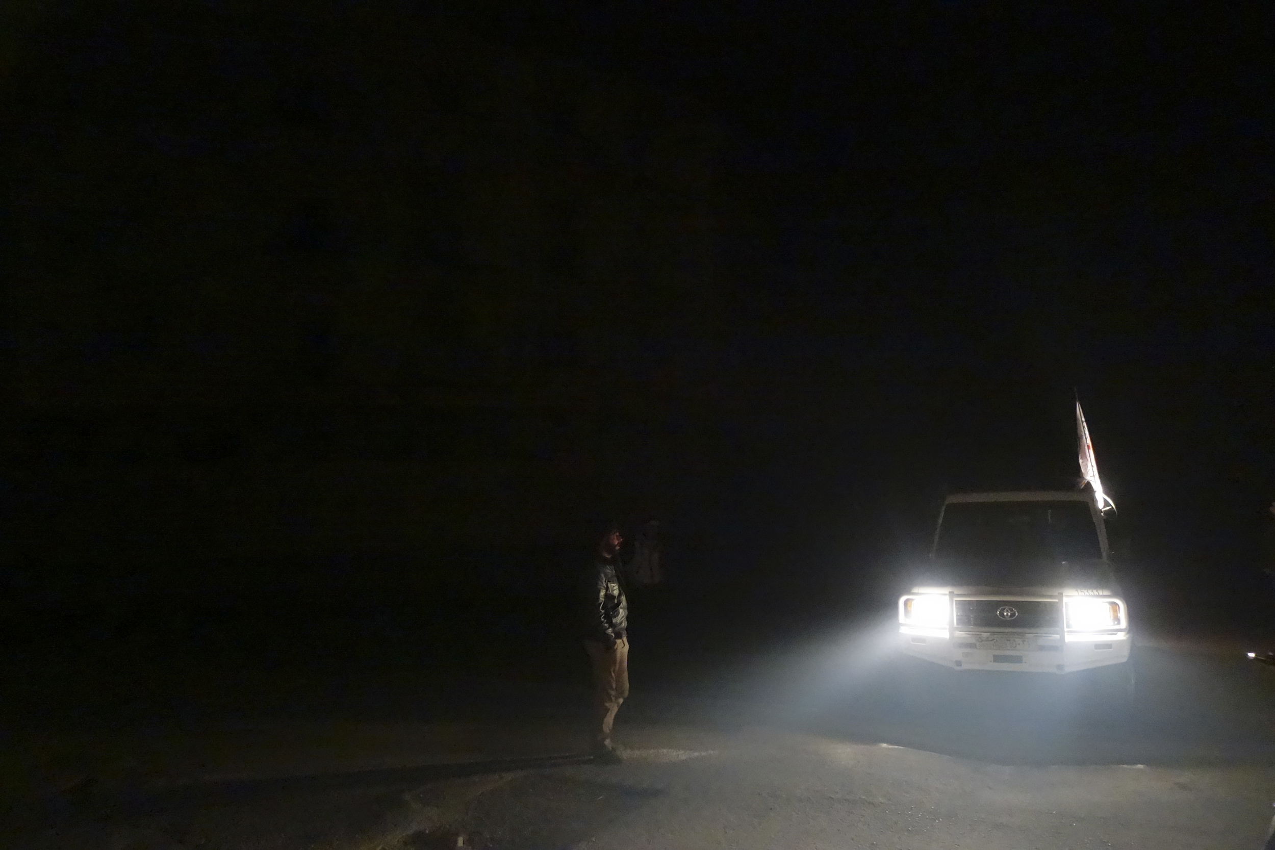 An ICRC car is seen in the besieged town of Moademiyeh during a joint aid operation by the Syrian Arab Red Crescent and the ICRC on February 3, 2016. ©ICRC/KRZYSIEK, Pawel