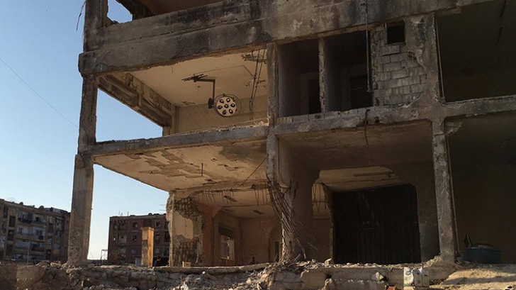 One of hundreds of destroyed buildings in Homs. Five years on, the crisis in Syria has brought colossal suffering on millions of people. Copyright: ICRC / P. Kryzsiek