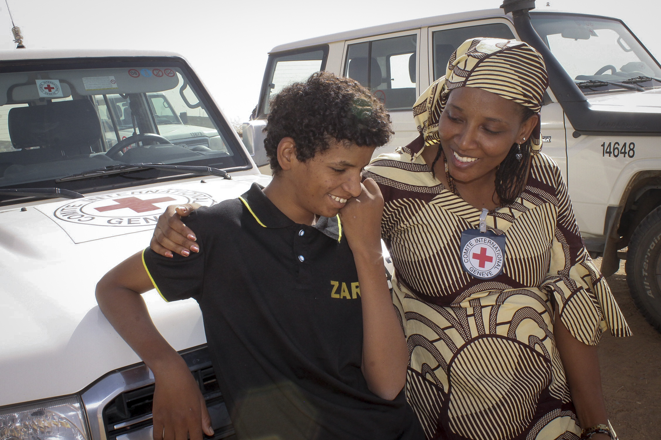 The principle of humanity is difficult to define in a single image, but this photo of an ICRC worker with a young refugee who had been reunited with his family in Mali in 2014, seems to capture the spirit of humanity - the notion of one person being their for another, providing a sense of hope and relief. 