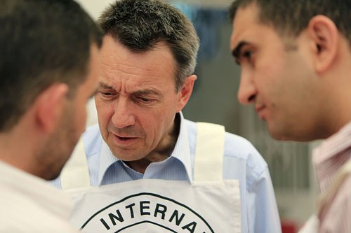Syrian Arab Red Crescent medical unit, Qaboun, Rural Damascus, Syria. ICRC president Peter Maurer talks to a local resident. © ICRC / I. Malla