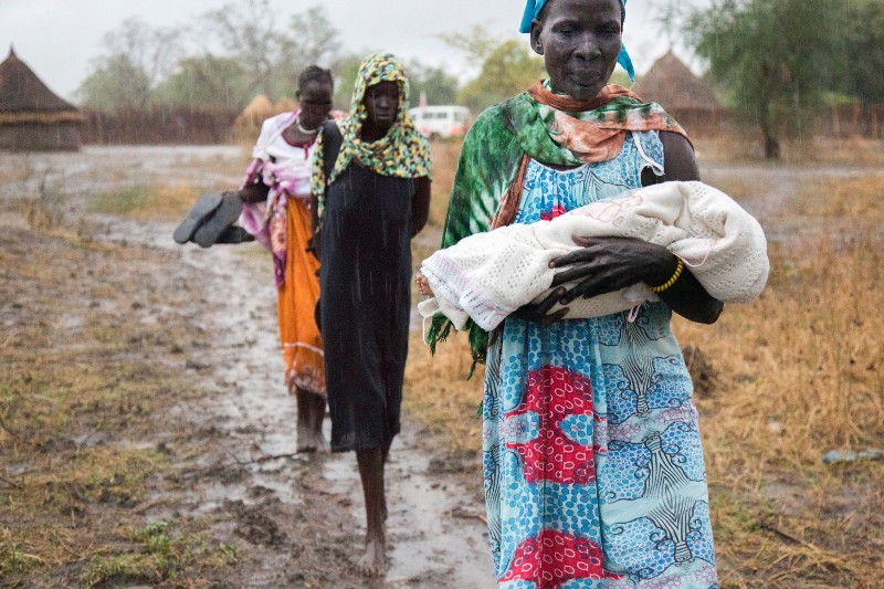 Nyamuoch, centre, and her relatives carry Nyanene’s body back to their village.