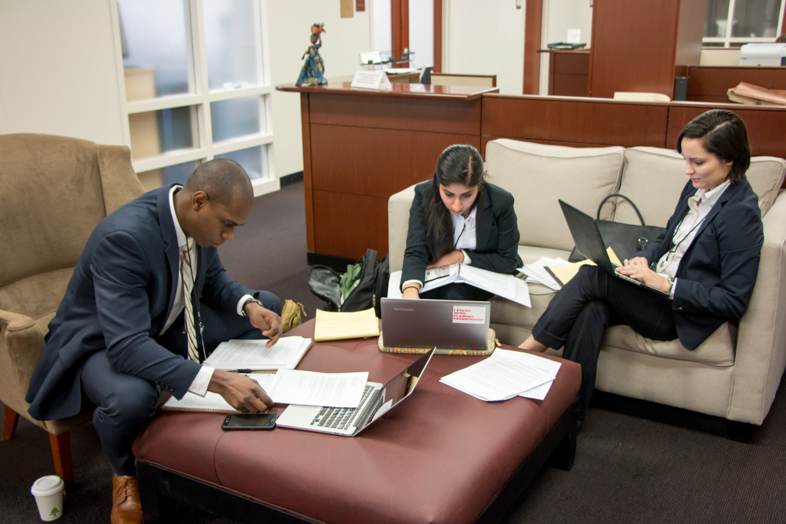 Students from the Harvard Law School team prepare for their next round. Joe Gibson/American Red Cross