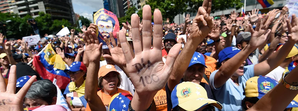 Opposition activists take part in a demonstration against President Nicolas Maduro in Caracas on July 9, 2017 (Juan Barreto/AFP/Getty Images)