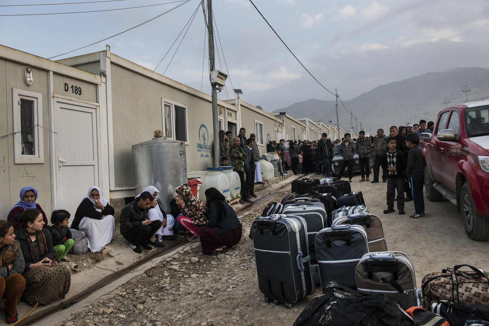 A camp for Yazidi refugees, some of whom were about to leave for resettlement in Germany, near Dohuk, Iraq, Jan. 2016. Some of the women had escaped sexual slavery at the hands of ISIS. Photo Courtesy of The New York Times/ Lynsey Addario