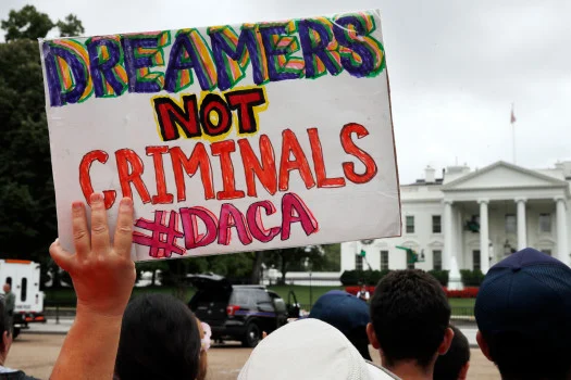 A woman holds up a signs in support of the Obama administration program known as Deferred Action for Childhood Arrivals, or DACA, during an immigration reform rally, Tuesday, Aug. 15, 2017, at the White House in Washington. The Trump administration has said it still has not decided the program’s fate. (AP Photo/Jacquelyn Martin)