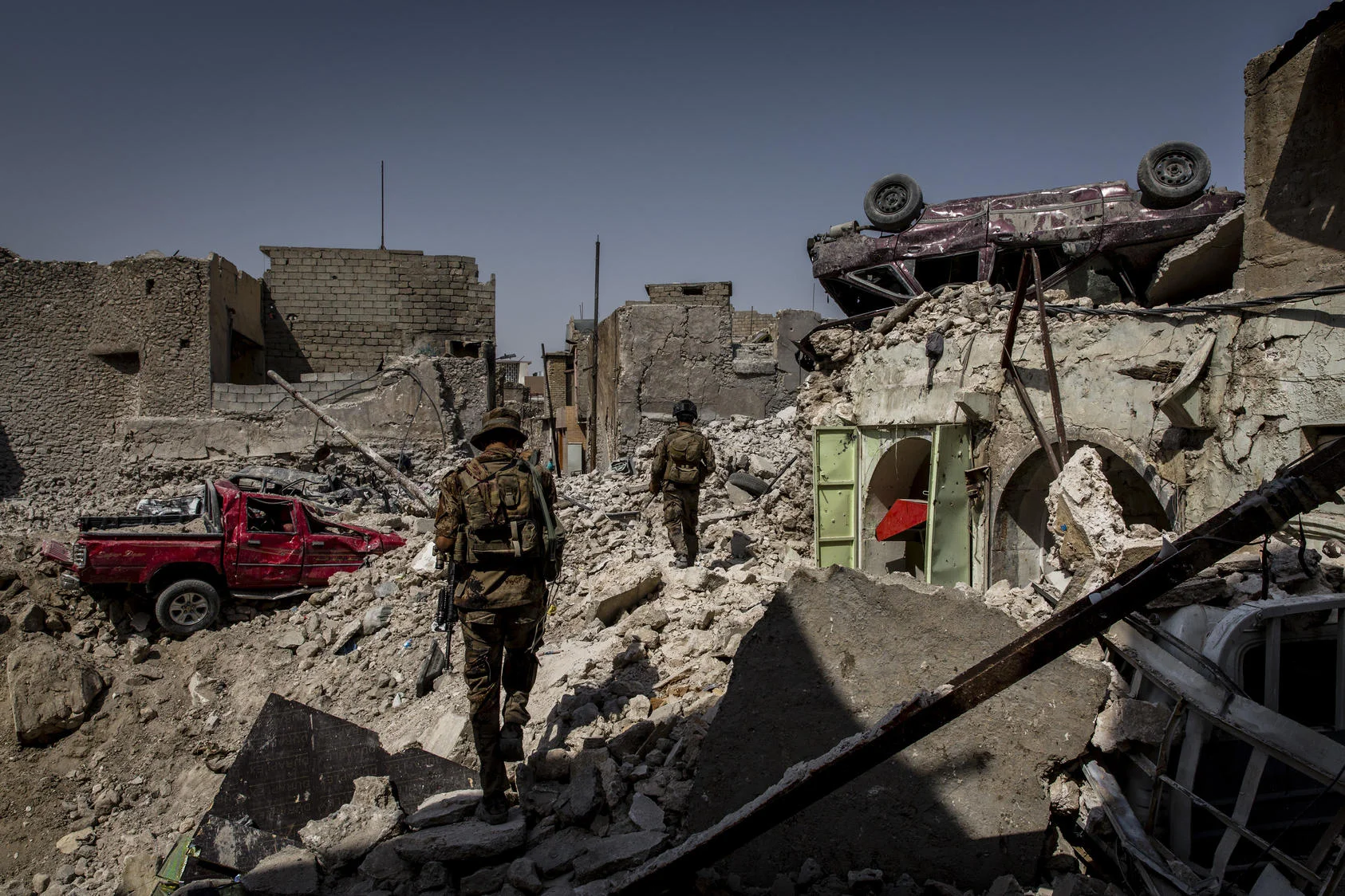 Iraqi special forces soldiers search houses for explosives and any remaining Islamic State fighters in a destroyed section of the Old City of Mosul, Iraq, July 23, 2017. Photo courtesy of Ivor Prickett/The New York Times.