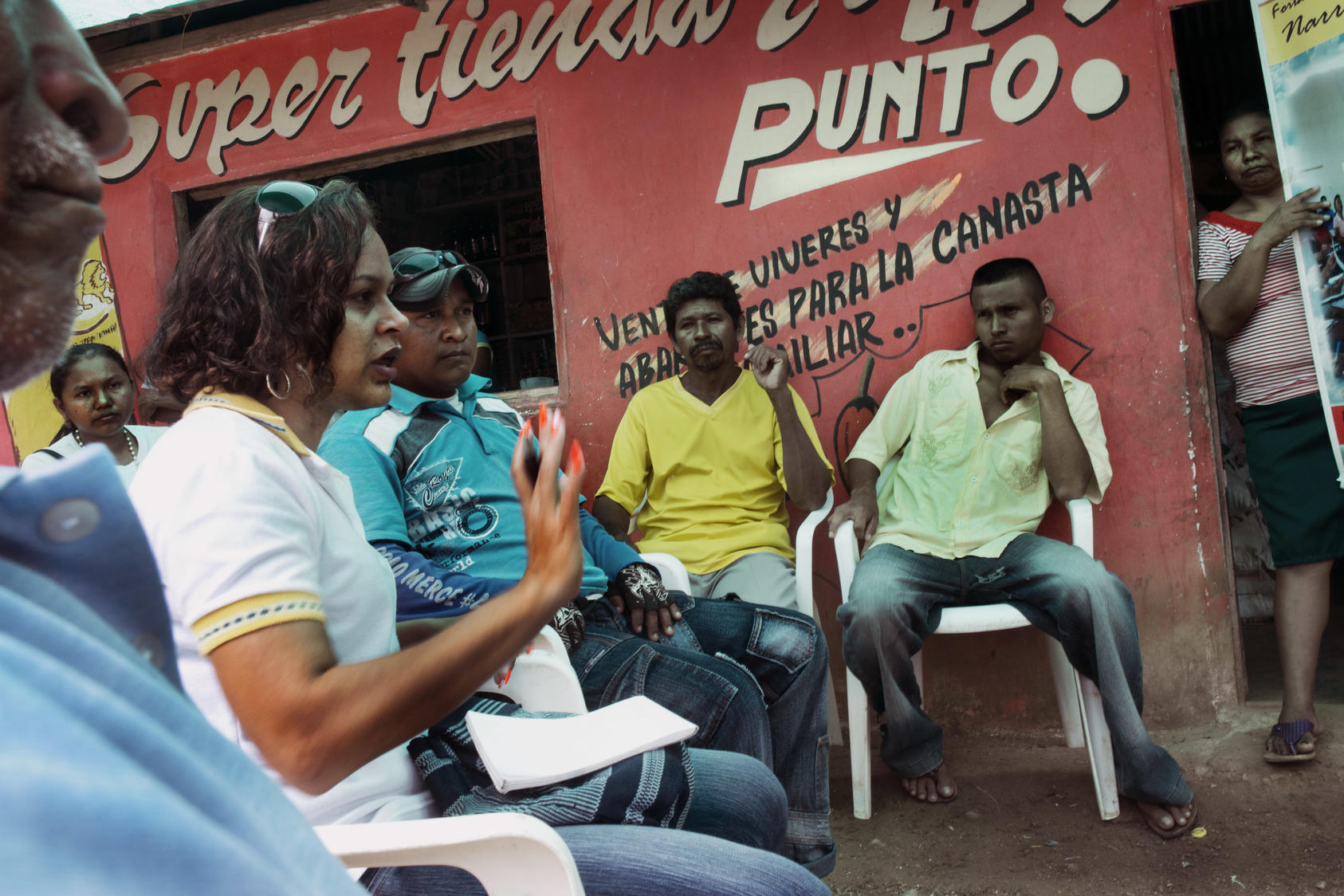 Mayerlis Angarita, an activist who visits remote villages encouraging people to make land claims, meets with people displaced by paramilitaries from their land in Sucre, Colombia, Nov. 2012. Photo Courtesy of the NYT/Stephen Ferry