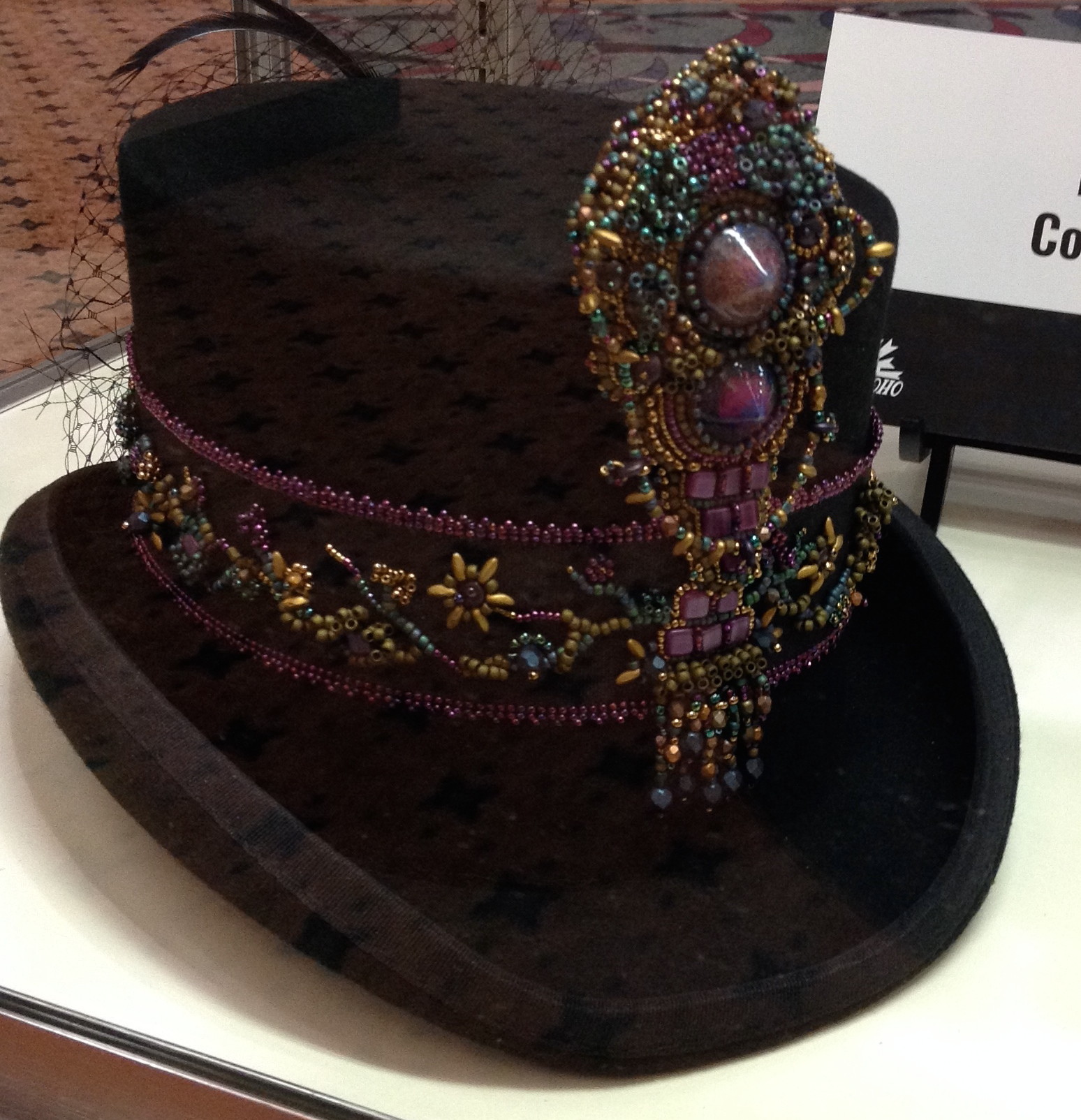 The embellishment on this top hat was created by Kathy Cosgrove.
