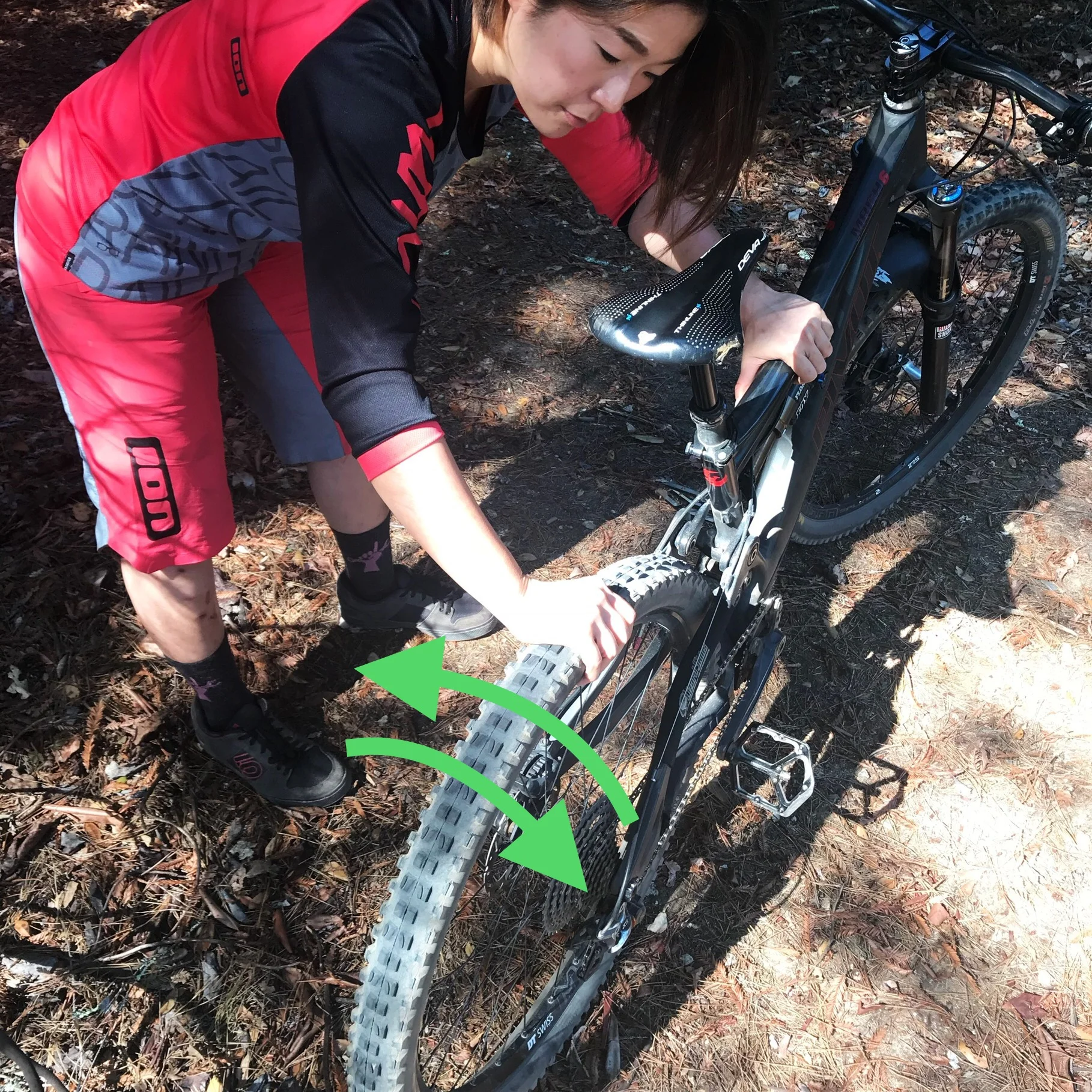 Check on how secure your wheels are by trying to rock each wheel laterally, in the direction of the green arrows.