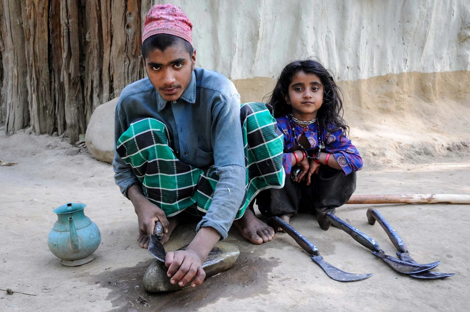 Mir Hamza, sharpening a patal, with Salma