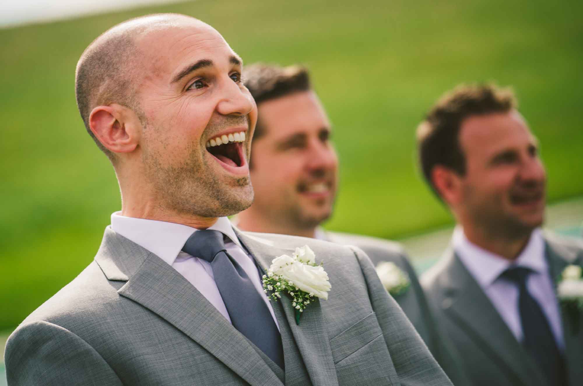 Groom reaction shot first look at bride