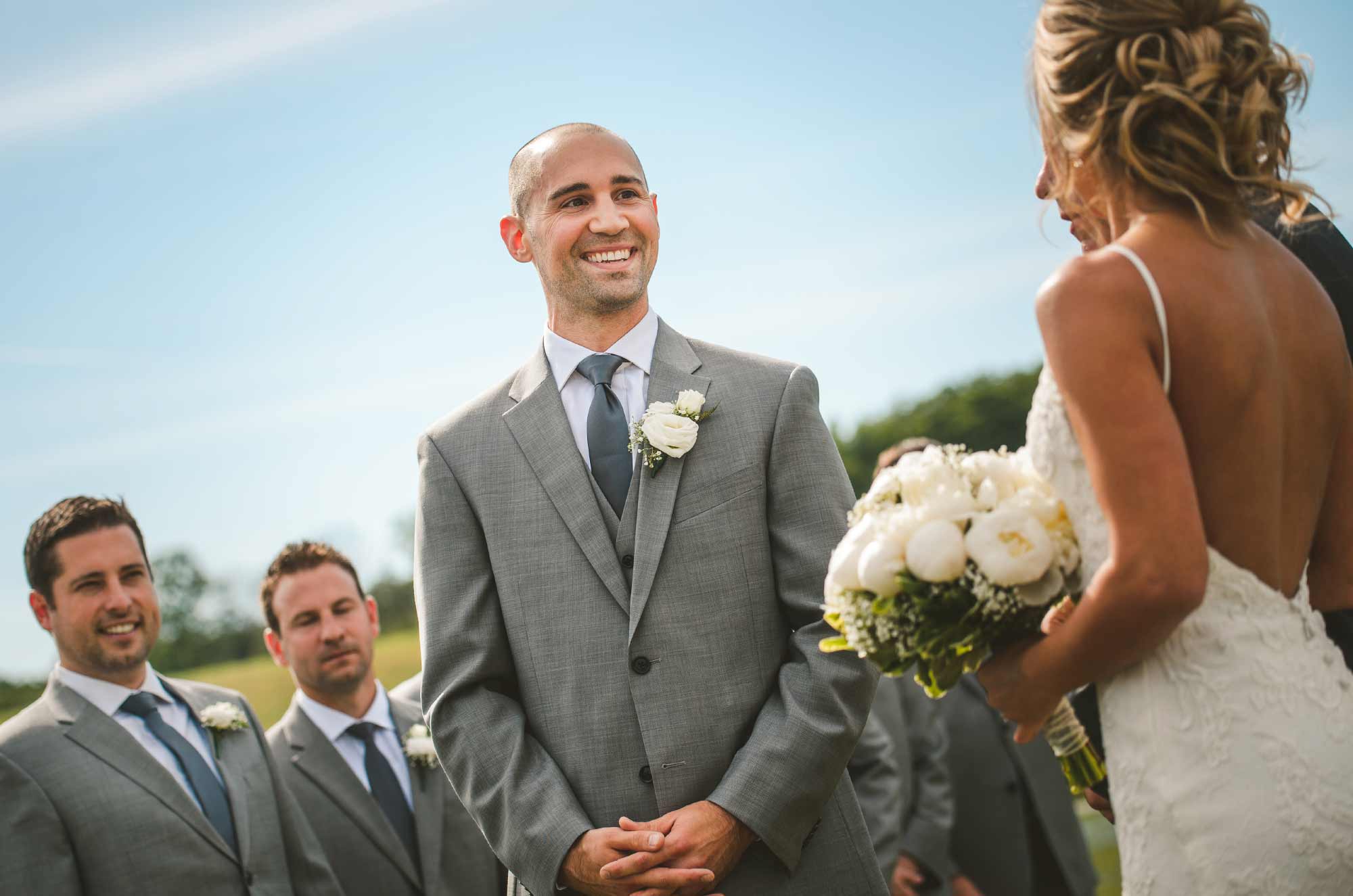 Groom looking at bride during wedding ceremony