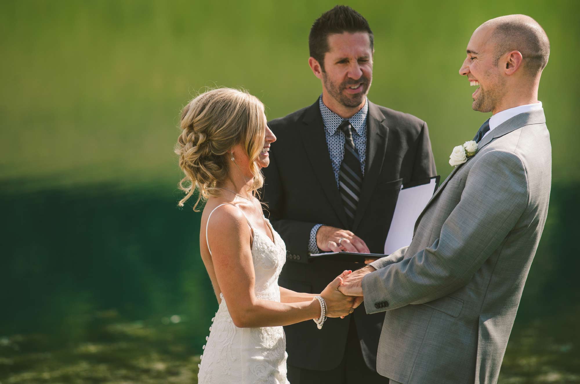 Bride and groom laughing during ceremony