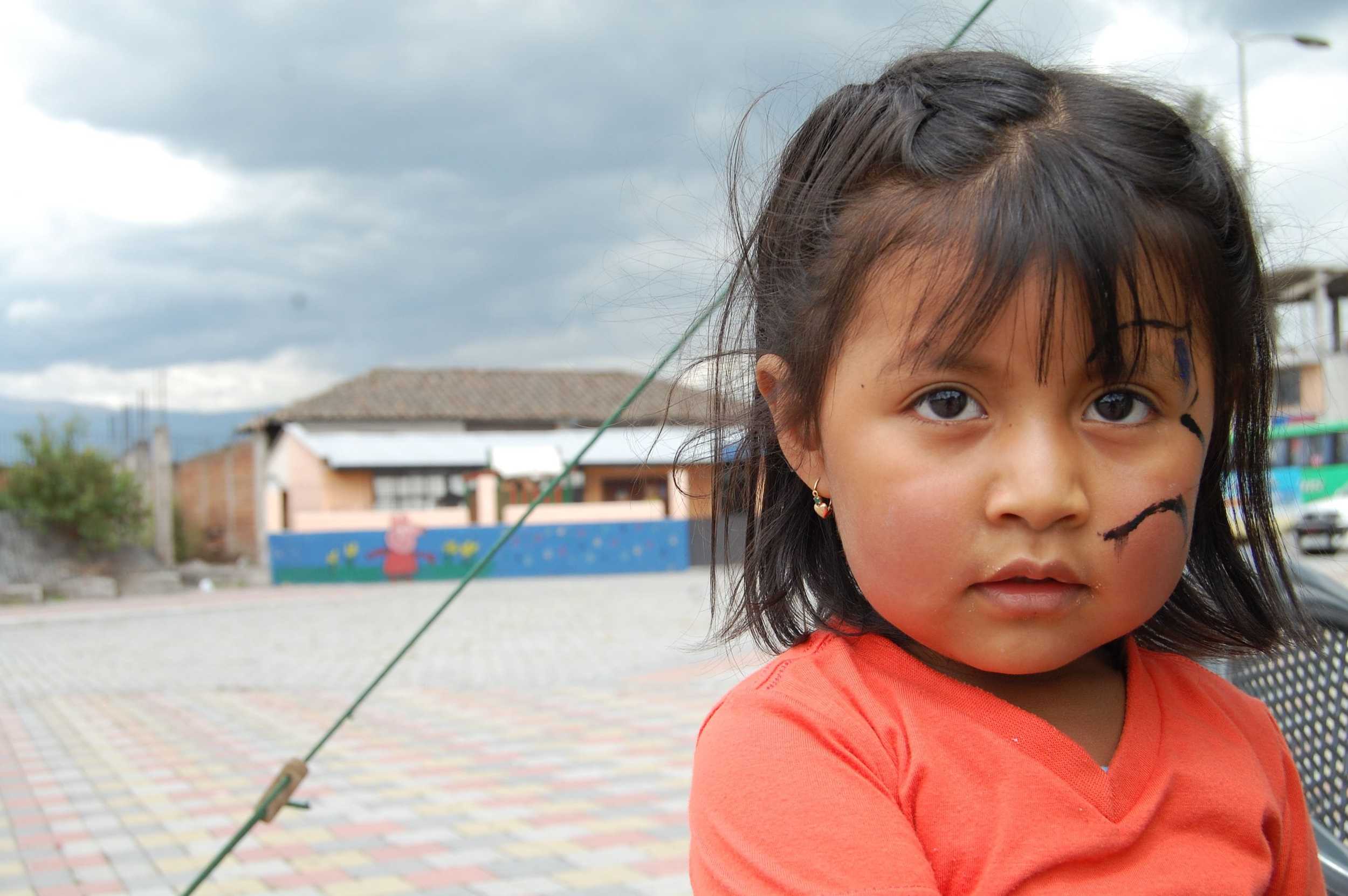 Small File Front Page Website Little Girl Ecuador Hornado Solidario Red-min.JPG