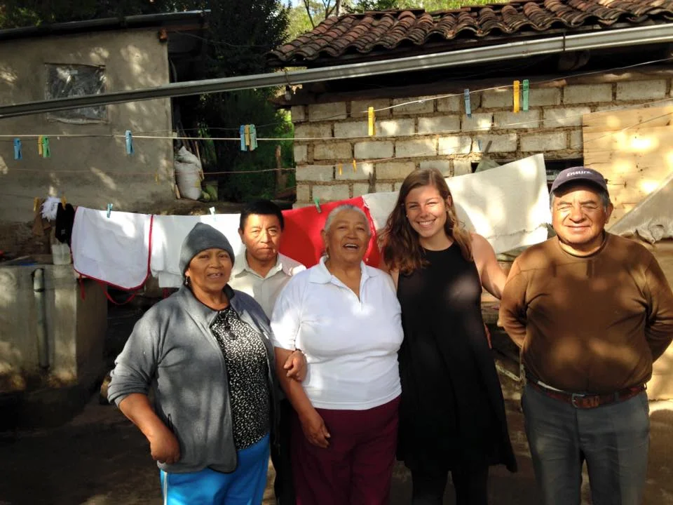 Former Program Director Alex, with Clemencia and her family at Clemencia's home in Amaguaña, Ecuador.