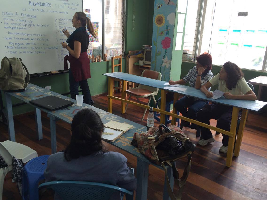 Here I am leading one of our first entrepreneurship classes. Our graduates have a 100% success rate, going on to find jobs in their field or start their own small businesses.